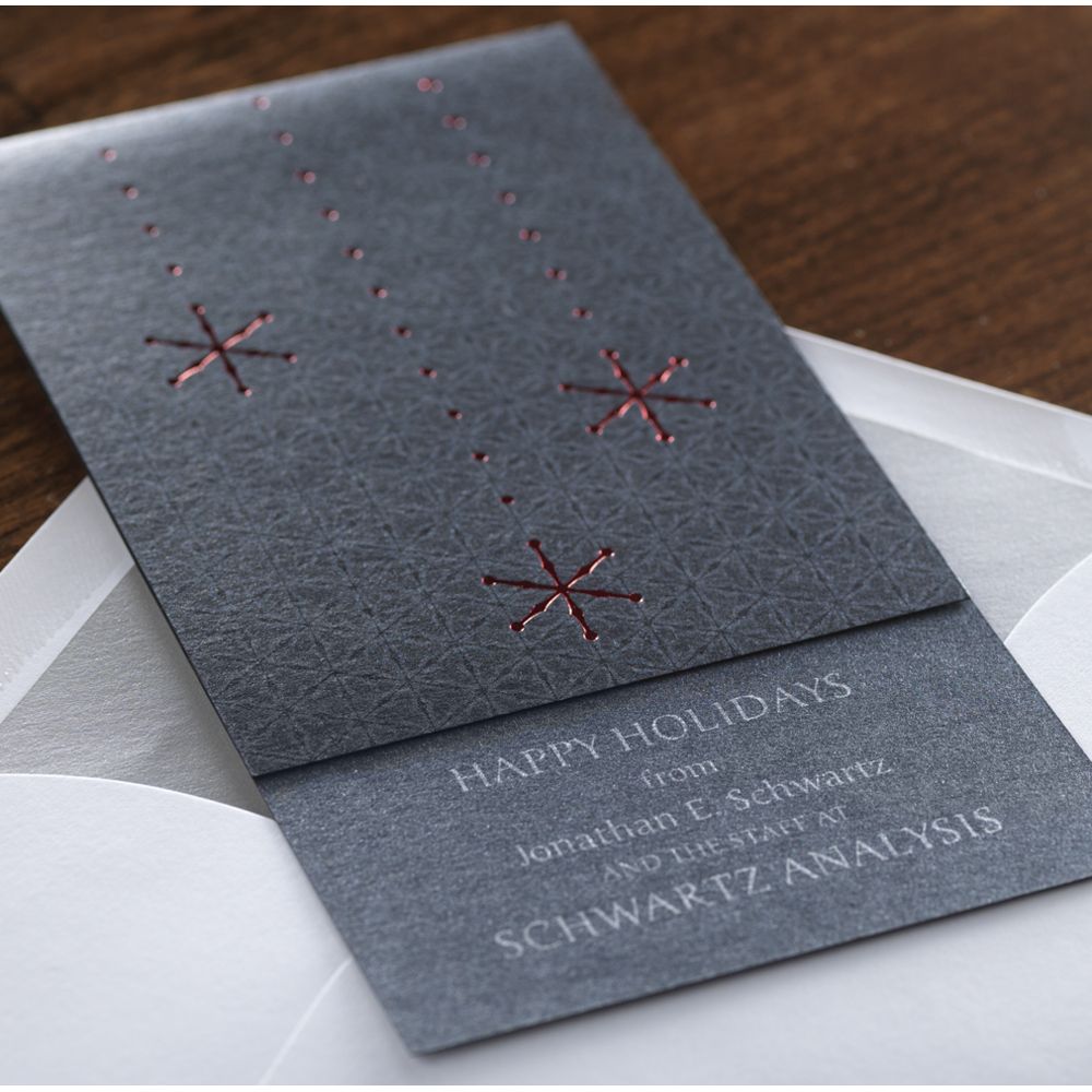 A stamped foil card stock on a business holiday card.